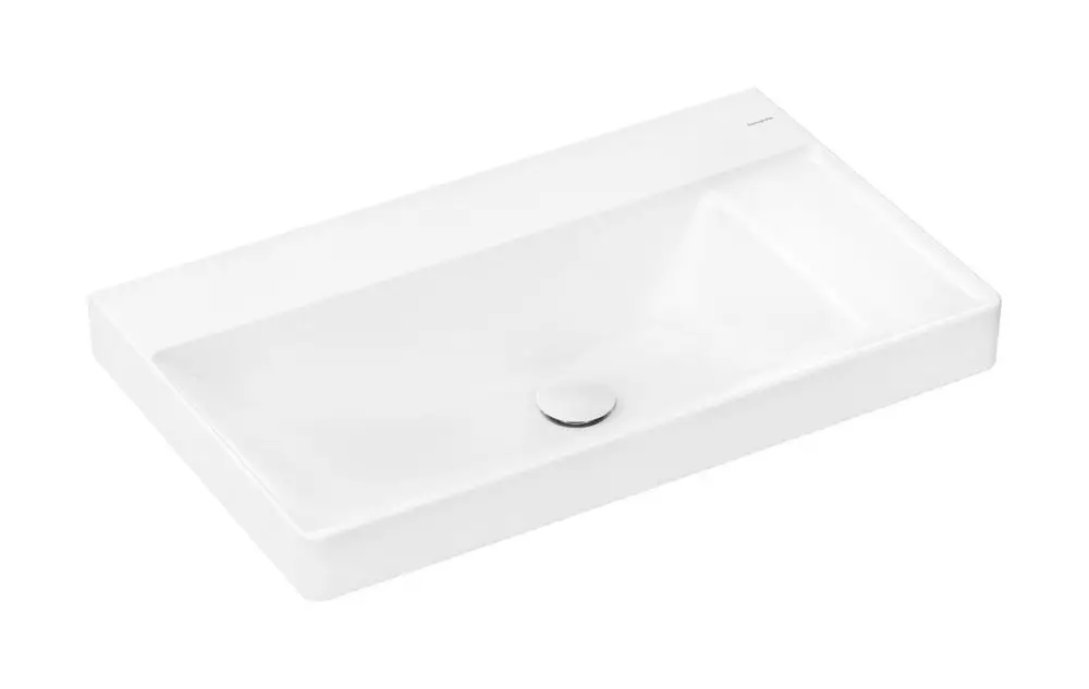 Weißer Waschtisch mit rechteckiger Form und integrierter Ablage auf der rechten Seite. Ohne Hahnloch und Überlauf. Hersteller: Hansgrohe.